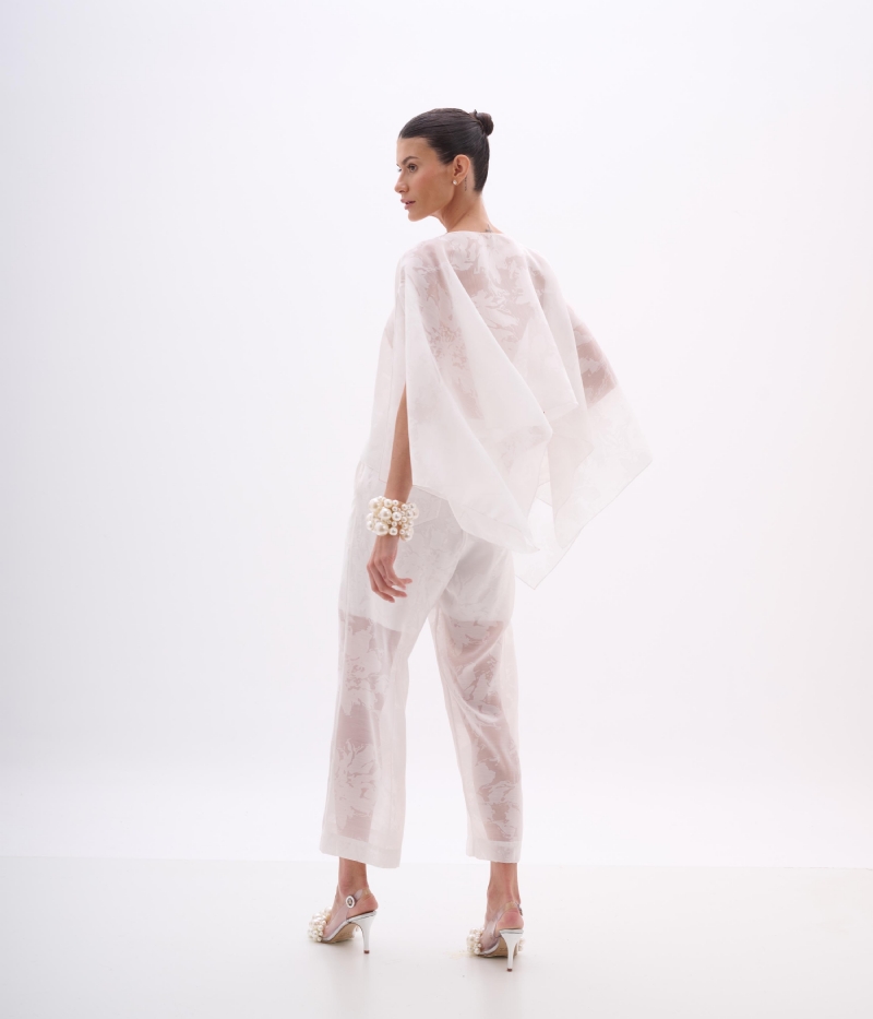 CALÇA FLUIDA EM DEVORÊ OFF WHITE COM TEXTURA E TRANSPARÊNCIA