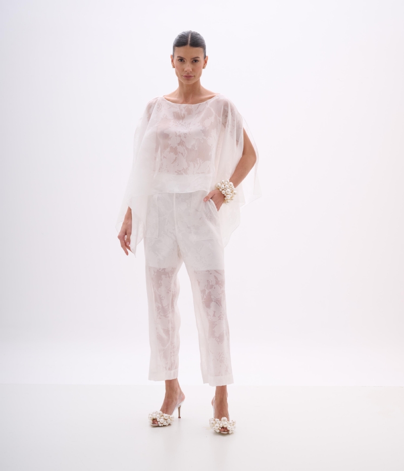 CALÇA FLUIDA EM DEVORÊ OFF WHITE COM TEXTURA E TRANSPARÊNCIA